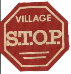Village stop jacket patch with the village s.t.o.p. logo.