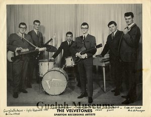 Black and white photograph of the velvetones including norm shaver  gerry lafontaine  lyle kreller  bert hamer  stu townsend and mc and manager carl mccrae.