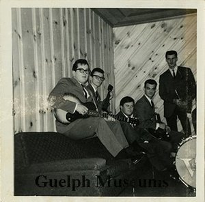 The velvetones including norm shaver  gerry lafontaine  lyle kreller  stu townsend and mc and manager carl mccrae %28bert hamer and his bass drum are partially visible along the right side of the image%29.