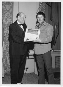 R. dean taylor receives a bmi certificate of honor from harold moon  president of bmi canada.